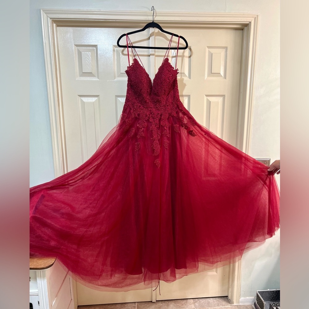 Red formal dress with lace up corset style straps and back with rhinestones